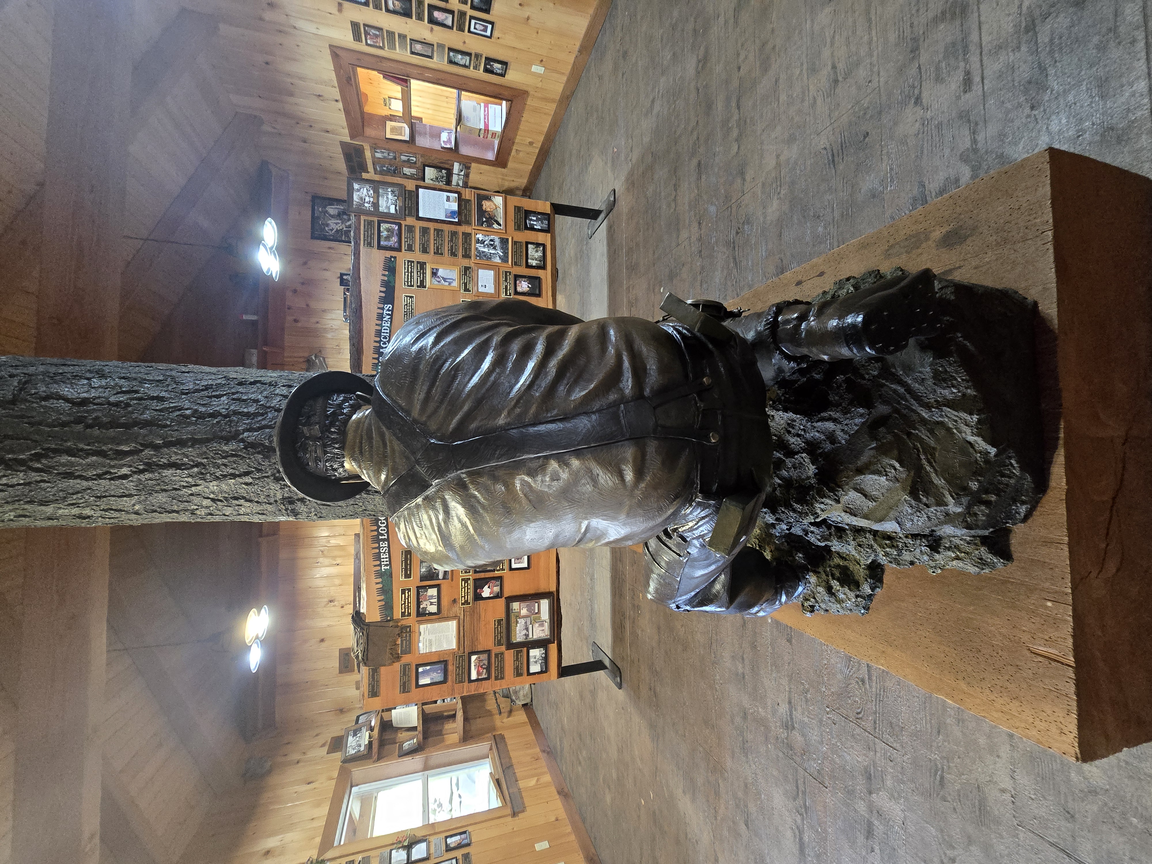 Bronze Man from behind — guardian of the Loggers Memorial, Camp 18